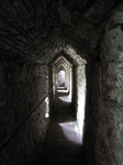 SX16121 Covered walkway towards caves under Carreg Cennen Castle.jpg